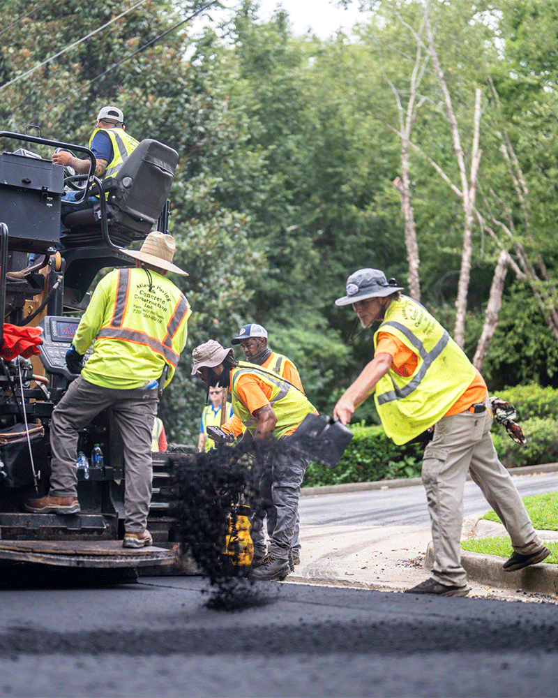 APCC, employees on paving machine on road, working together, 23137_BUILDWITT_1232