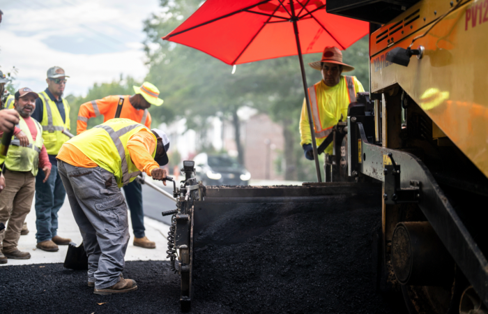 APCC, Employees paving, asphalt, employee bent over, 23137_BUILDWITT_1034